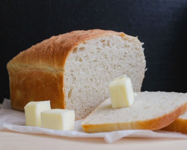 bread on white ceramic plate butter